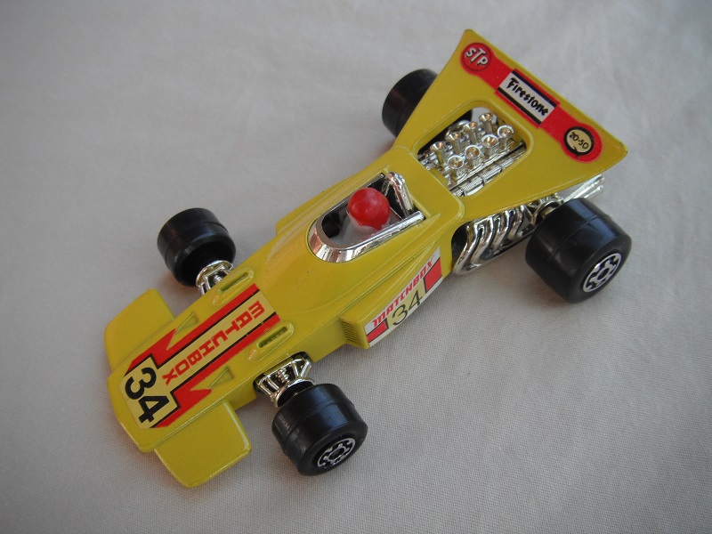 10.Yellow body/unpainted Speedkings base/wider rear wheels/white driver w/red helmet/&quot;Matchbox 34&quot; yellow labels.