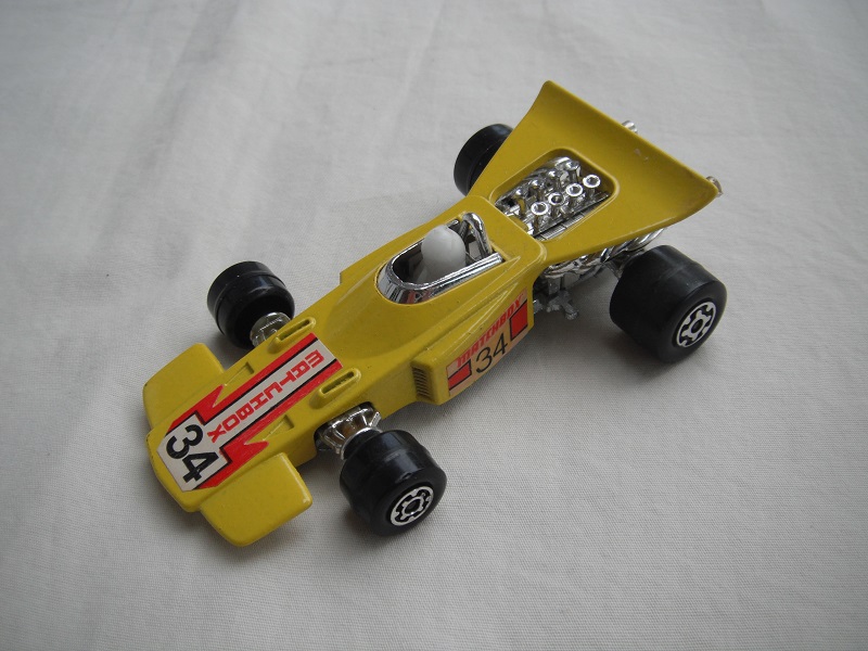 8. Yellow body/unpainted Speedkings base/wider rear whls/wht driver/no helmet/&quot;Matchbox 34&quot; wht lbls/no rear label/K35A engine.