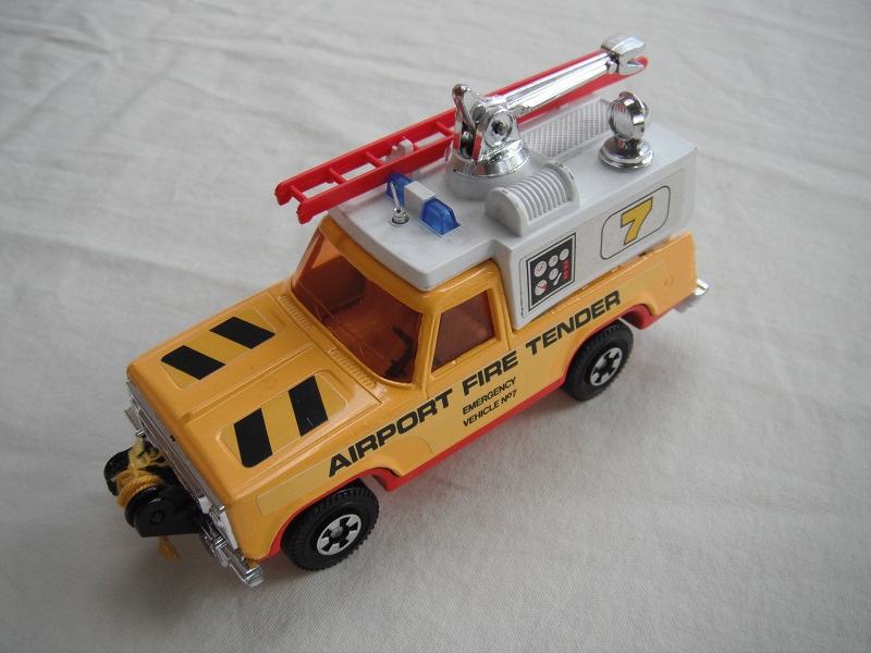 9. Yel body/wht canopy/red base/blu dome lts/red ladder/dk.amber windows/lrg steering/&quot;Airport Fire Tender&quot;/gauges &amp; 7 label/yel cable.