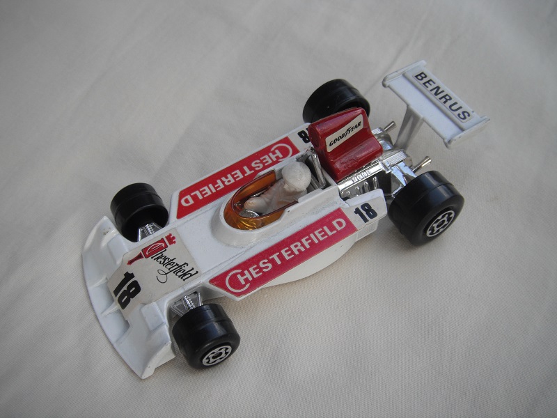 4. Wht body/very dk.red spoiler/wht Speedkings base/dk.amb wind/lrg narrow rear whls/wht driver/lrg wht helmet/red Chesterfield 18/Benrus &amp; &quot;Goodyear lbls.