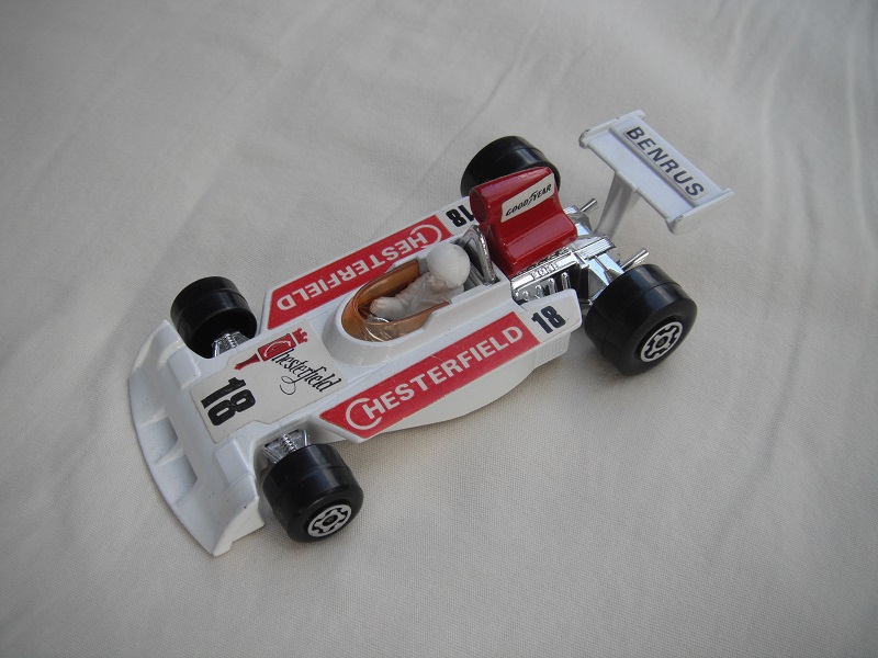 3. Wht body/dk.red spoiler/wht Speedkings base/amb wind/lrg narrow rear whls/wht driver/lrg wht helmet/red Chesterfield 18/Benrus &amp; &quot;Goodyear lbls.