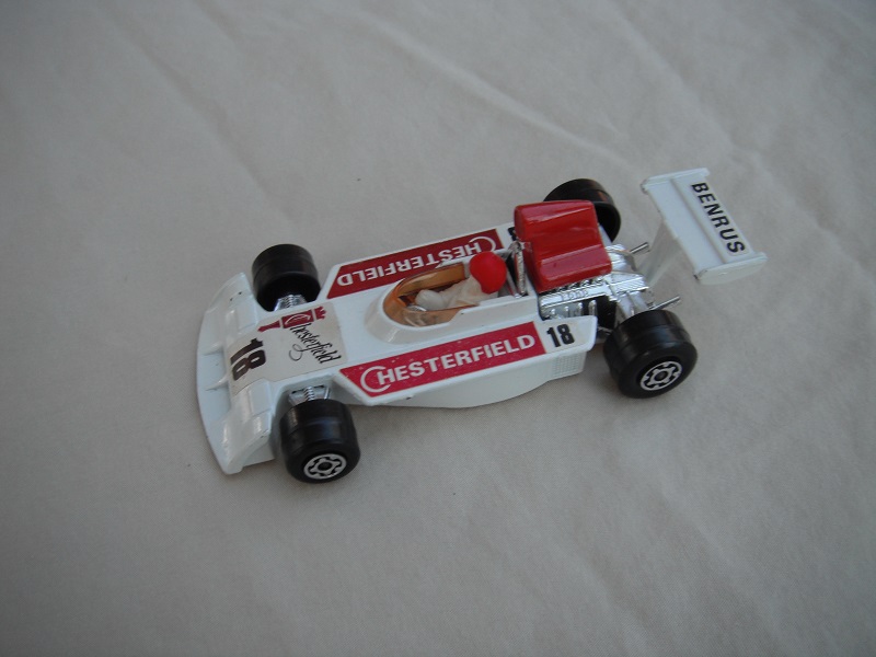 1. Wht body/red spoiler/white Superkings base/amb wind/sml narrow rear whls/wht driver/lrg red helmet/&quot;Chesterfield 18&quot; in dk.red, &amp; &quot;Benrus&quot; labels.