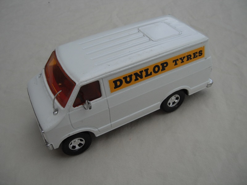 18. White body/black base/red interior/amber windows/black steering wheel/Dunlop Tyres Promo.