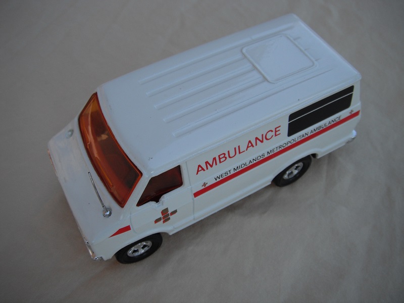 14. White body/black base/red interior/amber windows/red stripe on side only/West Midlands Metropolitan Ambulance/code 2 Promo.