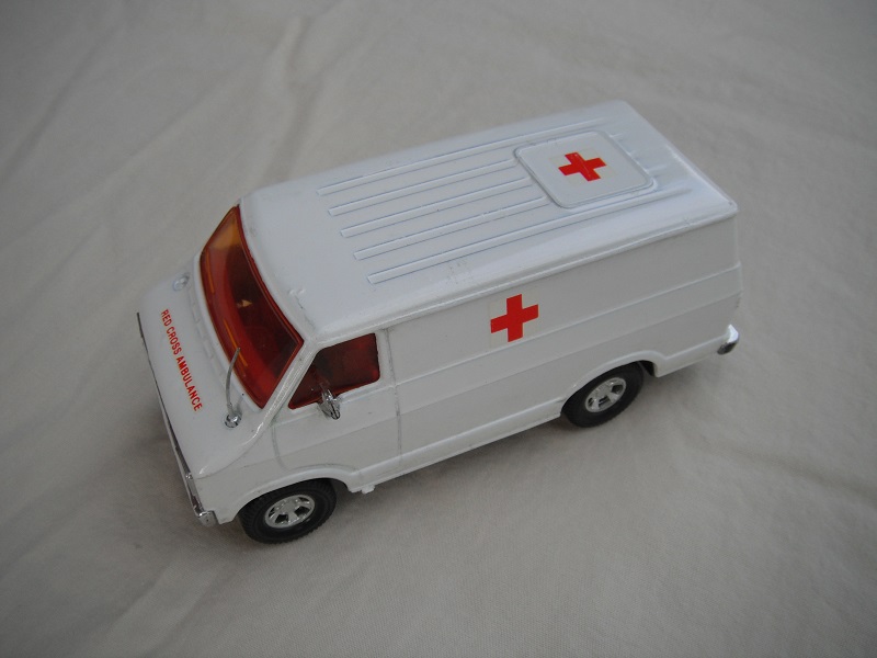 12. White body/black base/red interior/amber windows/black steering wheel/Red Cross Ambulance Promo.