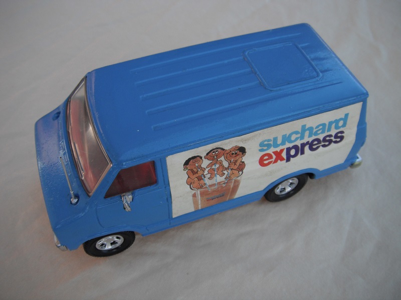 10. Blue body/black base/dark red interior/clear windows/no chrome outline around windshield/Suchard Express labels.