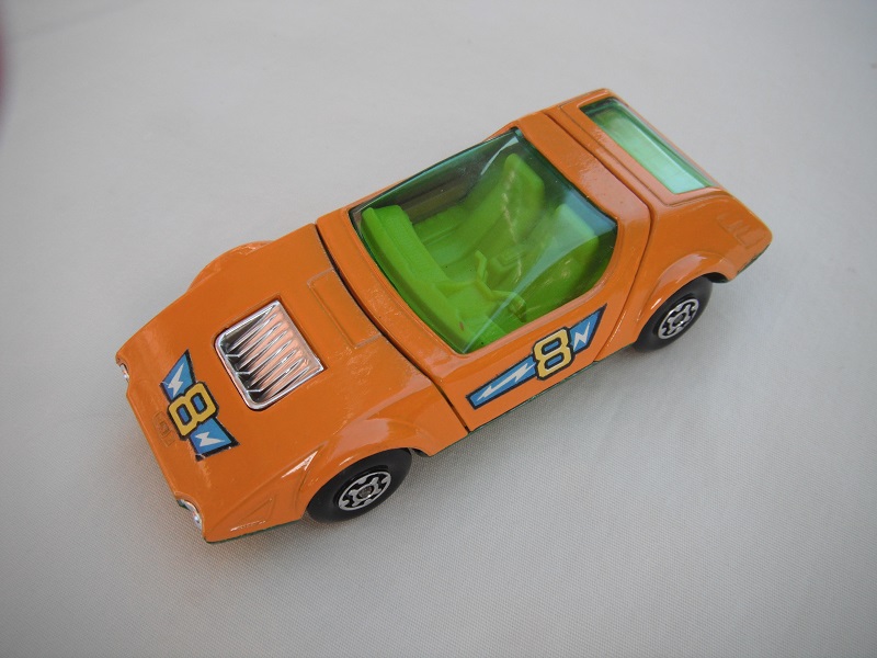 6. Orange body/gloss met.green base/MC wheels/yellow interior/green windows/&quot;8&quot; in dark yellow.