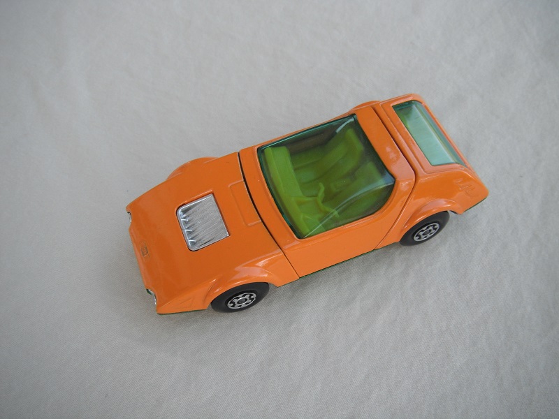 2. Dk.orange body/dull metallic green base/MC wheels/yellow-orange interior/green windows/no labels (PP).