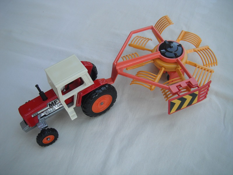 5. Red tractor/crm canopy/sil base/England/org hubs/Rotary rake w/dk.org frame/dk.yel rakes &amp; hubs/unpainted base/copper axle/wide tow eye.