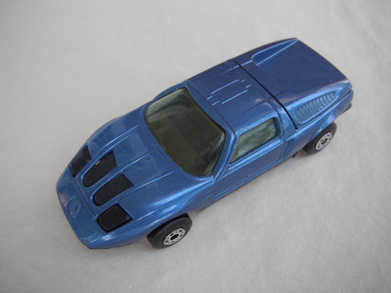 B9. Very dark blue body/black base/dot-dash wheels/clear windows/black interior &amp; headlights.