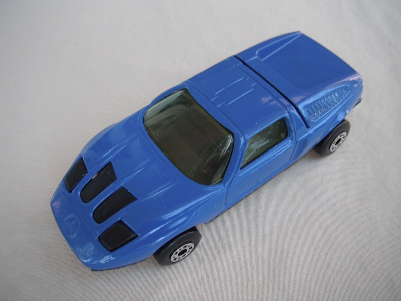 B8. Dark blue body/black base/dot-dash wheels/clear windows/black interior &amp; headlights.