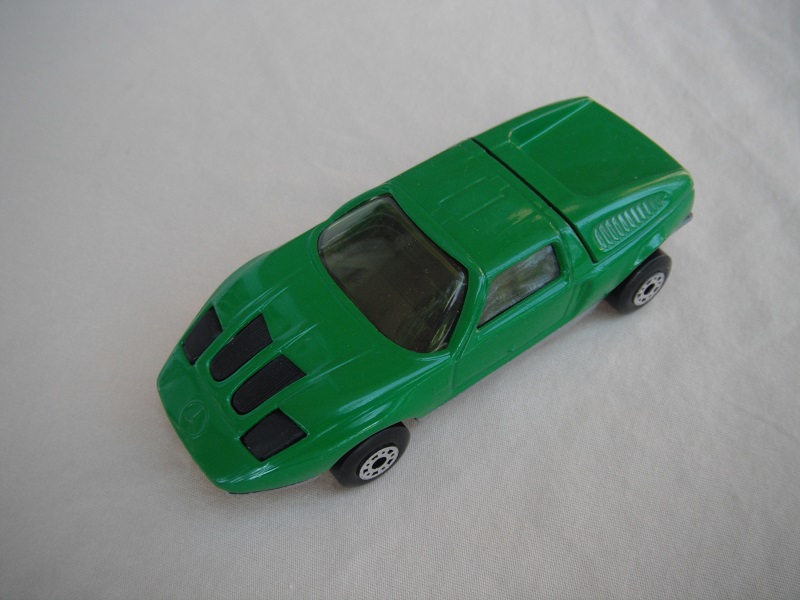 B4. Dark green body/silver base/dot-dash wheels/clear windows/black interior &amp; headlights.