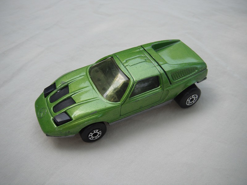B1. Lime green body/silver base/dot-dash front, 5 arch rear whls/lt.amber windows/black interior &amp; headlights.