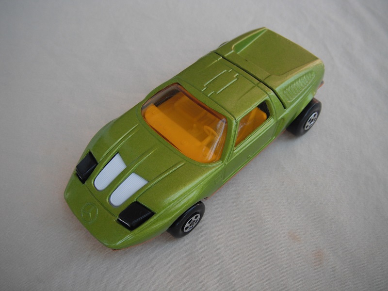 E16. Lime green body/gold base/five spoke wheels/amber windows/white interior/black headlights.