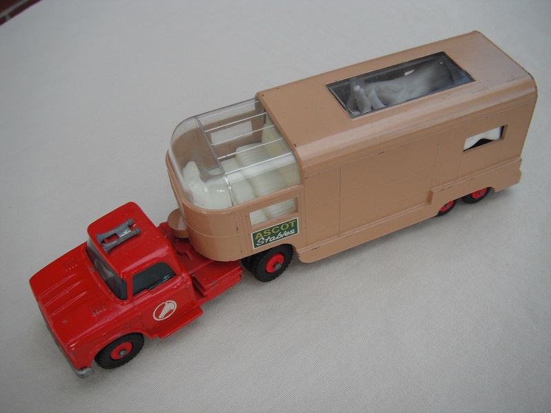 4. Red cab/type B base/red horse decal/tan trailer type B/dk.green Ascot Stables label/type B rear door/red axle spring/turquoise interior.