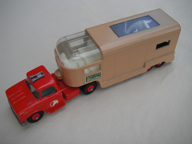1. Red cab/type A base/red horse decal/tan trailer type A/dk.green Ascot Stables label/type A rear door/red axle spring/gray interior.