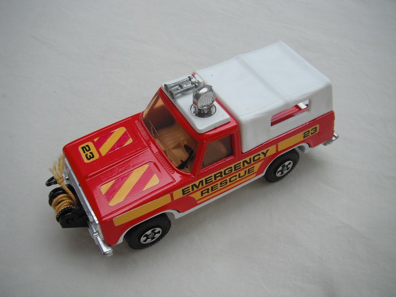 2. Red body/wht canopy/wht base/no K#/Superkings/lt.amber windows/&quot;Emergency Rescue&quot;/labels/&quot;23&quot; on hood/right side/&quot;23&quot; to rear.