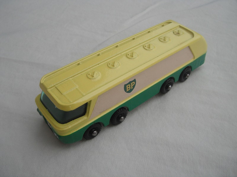 1. Lt.yellow/green body/blk base/black knobby wheels/green windows/BP side labels to front/silver trim on lights &amp; rear bumper.