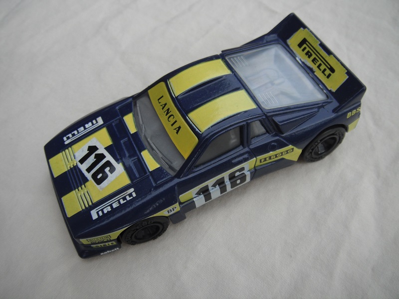 8. Dark blue body/yellow stripes/black base China/clear windows/gray interior/no chromed lettering on wheels/Pirelli #116.