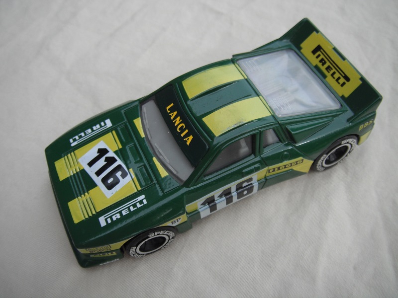 6. Green body/yellow stripes/black base Macau/clear windows/gray int/chromed lettering on wheels/large rear wheels/Pirelli #116.