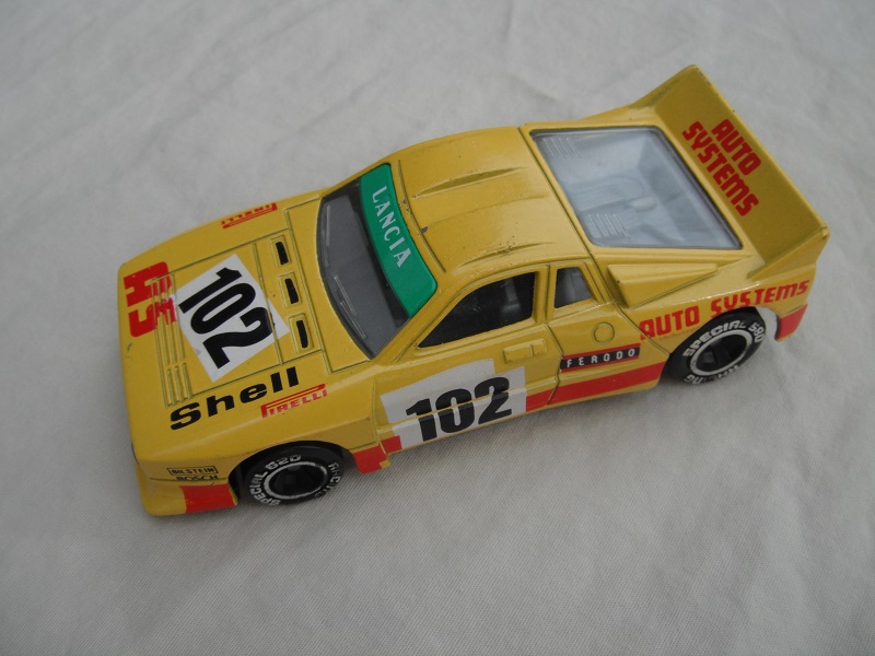 4. Yellow body/red stripe/black base Macau/clear windows/gray int/chromed lettering on wheels/Auto Systems #102.
