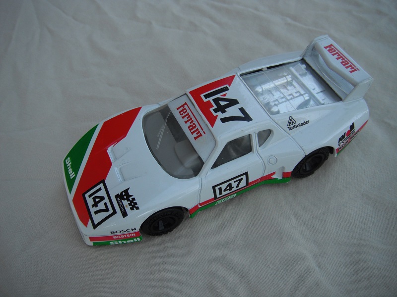 12.White, green &amp; red body/var.racing logos/black base China/gray int/clear windows &amp; headlights/unchromed wheels/&quot;Ferrari 147&quot;.