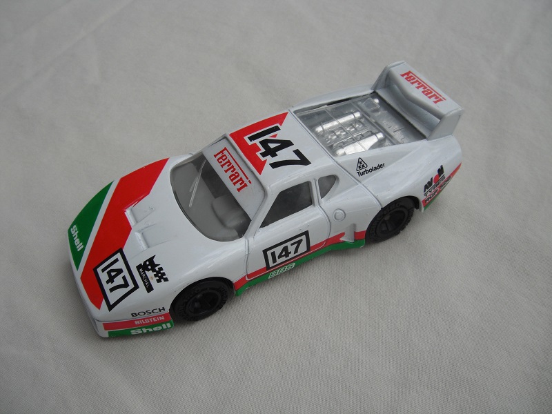 11.White, lt.green &amp; red body/var.racing logos/black base China/gray interior/clear windows &amp; headlights//unchromed wheels/&quot;Ferrari 147&quot;.