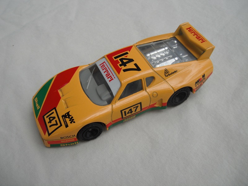 5. Dk.yellow body/var.racing logos/black base China/gray int/clear windows &amp; headlights/unchromed wheels/&quot;Ferrari 147&quot;.