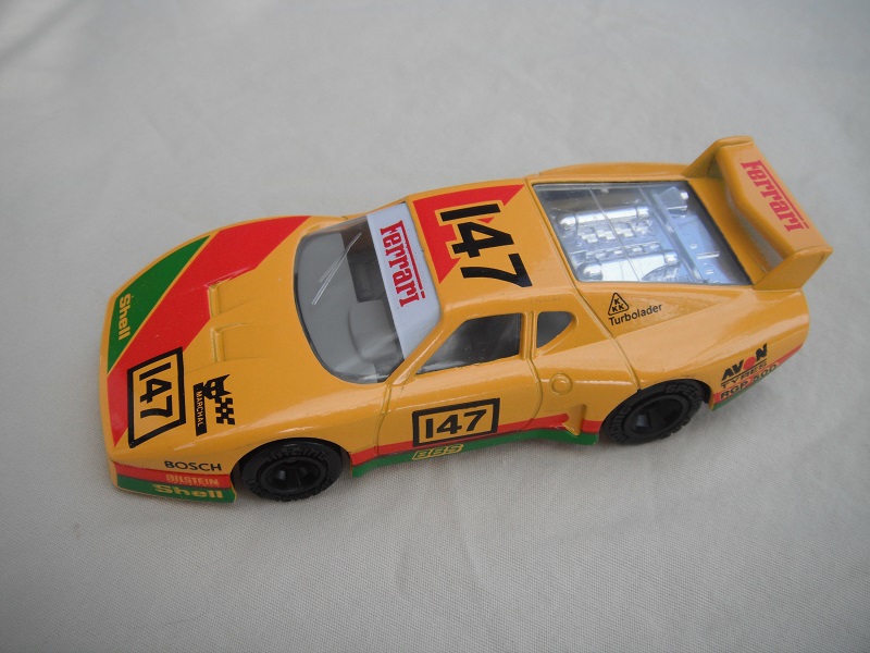 4. Dk.yellow body/var.racing logos/black base Macau/gray int/clear windows &amp; headlights/unchromed wheels/&quot;Ferrari 147&quot;.