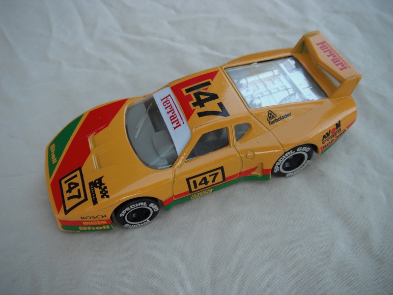 3. Dk.yellow body/var.racing logos/black base Macau/gray int/clear windows &amp; headlights/chromed lettering on wheels/&quot;Ferrari 147&quot;.