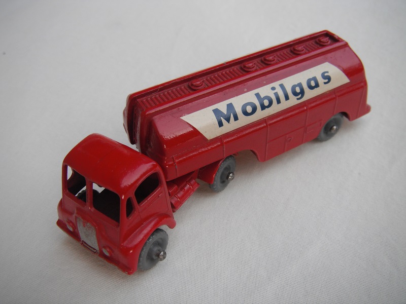 2. Dk.red cab/type A/dk.gray wheels/knobby threads/type A trim/dk.red tank/decals on cream background.