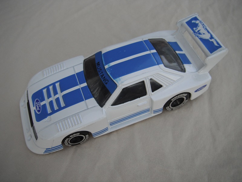 17.White and blue body/black base China/clear windows/black interior/chromed lettering on wheels/Ford Mustang.