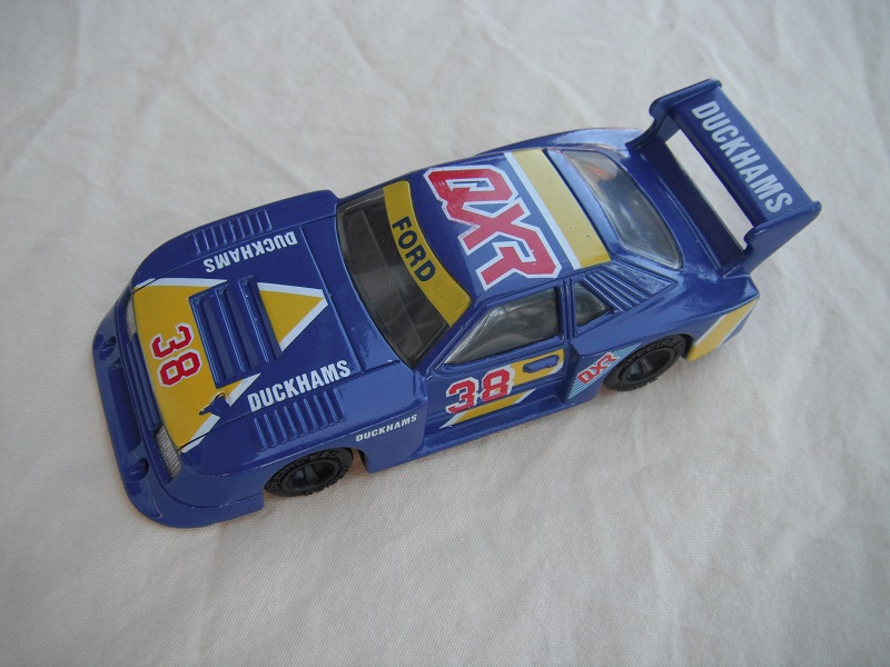 11.Blue &amp; yellow body/black base Macau/clear windows/black interior/no chromed lettering on wheels/QXR Duckhams #38.