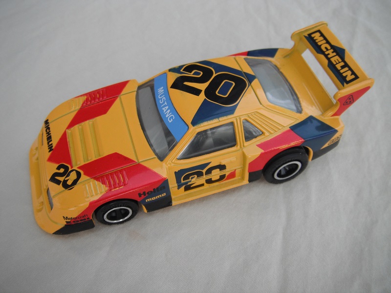 3. Dk.yellow body/black base Macau/clear windows/gray interior/black wheels/pullback motor/large Michelin on rear spoiler/#20.