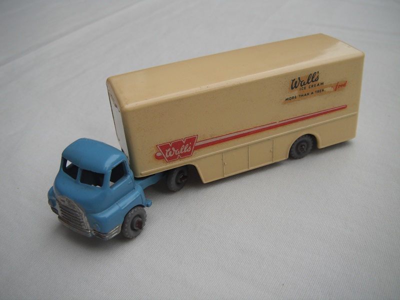 2. Pale blue cab/type 1/matt black base/GPKW/type 1 trim/dk.cream trailer/Wall's Ice cream to rear.