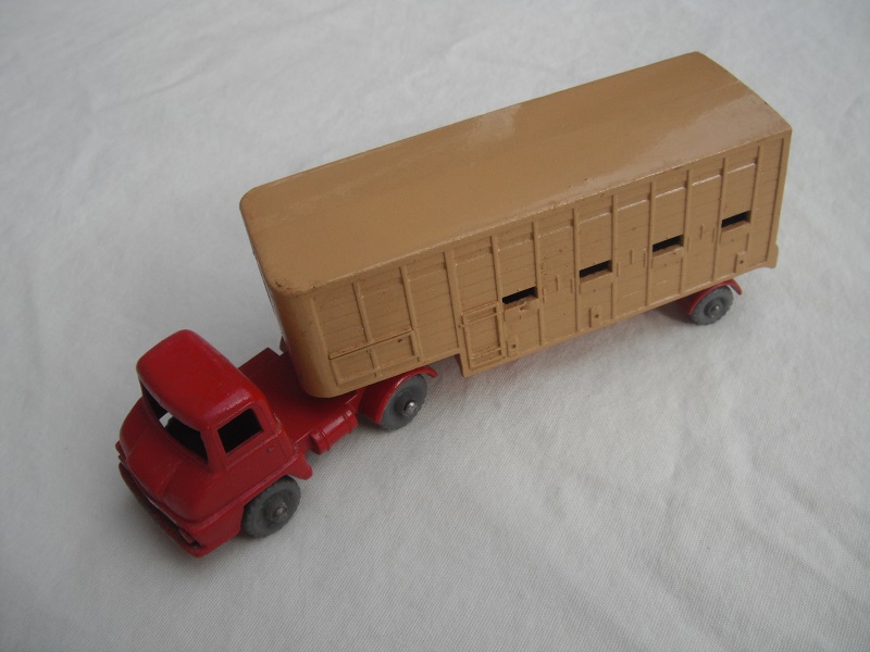 2. Dull red cab/type A/DGKW/silver trim/dk.tan trailer type A/red base/type A external/type A internal/rear cross frame type A/lt.tan rear door.