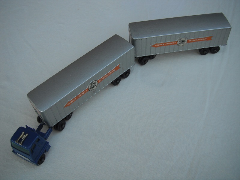 7. Blu cab/blk base/type B/wheels type B/gold horns/sil trim/sil-gry trailer/type B/base type B/legend type B/sil rear doors/dolly type B/decals type C.
