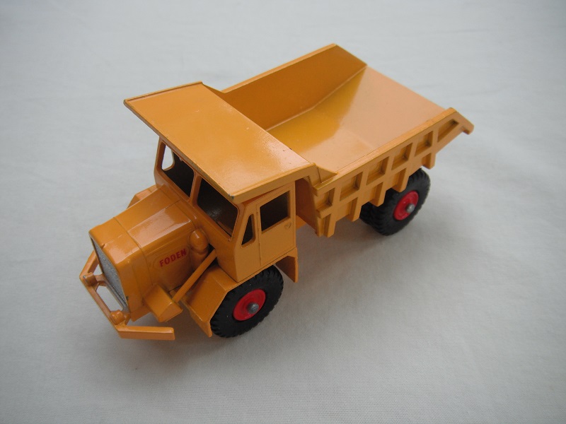 7. Dark yellow body/BPT w/red plastic hubs/smooth casting underneath tipper/short steering column/&quot;Foden&quot; decals.