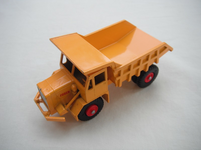 6. Dark yellow body/BPT w/red plastic hubs/smooth casting underneath tipper/long steering column/&quot;Foden&quot; decals.