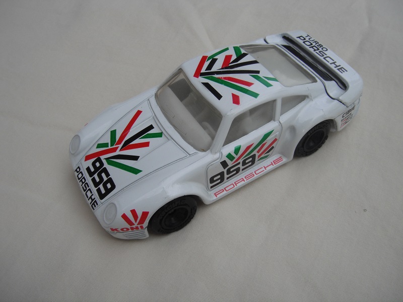 10.White body with blk/grn/red graphics/white base China/white interior/clear windows/unchromed wheels/Porsche 959.