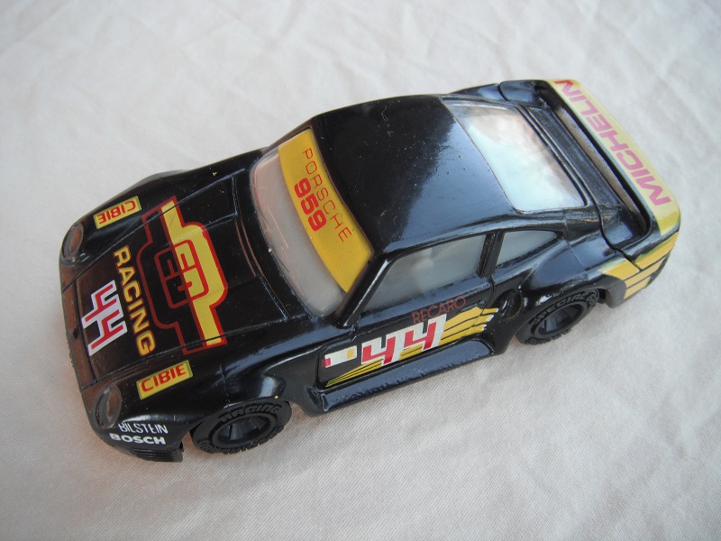 6. Black w/yellow stripes/black base China/gray interior/clear windows/unchromed wheels/Michelin #44.