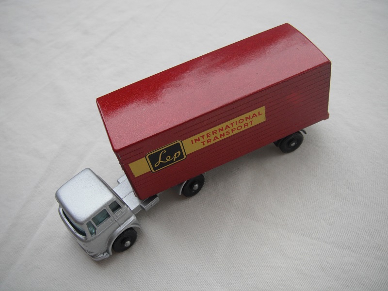 5. Silver cab/blk base/BPFW/grn windows/maroon trailer/typ B/blk base/angled connector/blk rear door/LEP decals.