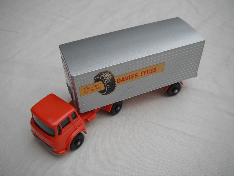 4. Orange cab/blk base/BPFW/grn windows/sil trailer/typ A/lt.org base/centered connector/org rear door/Davies Tyres decals.