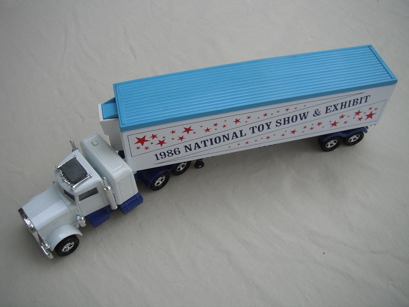 1. White cab/type E dk.blue base/unpainted AC/5SMW/white trailer/K17/dk.blue 1973 Lesney base/5SMW/black closed axle cover.