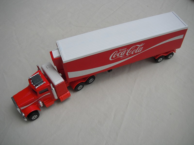 10.Red cab/type C red base/unpainted AC/white sleeper/LMCW/red K17 trailer/1973 Lesney base/SMCW/black open axle cover.