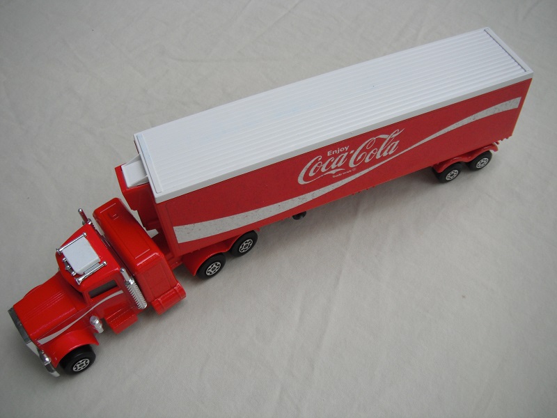 6. Red cab/type B red base/white AC/LMCW/red K17 trailer/1973 Lesney/SMCW/black closed axle cover/reversed cab labels.