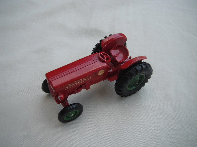 3. Red body &amp; base/no hole on base/dk.green metal hubs/square tow hook/silver headlights/small decal.