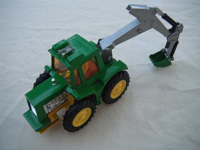 24.Green tractor/no plow/silver backhoe &amp; green scoop/amber windows/thin tires/light yellow hubs/light yellow base/red int/1984 China cast.