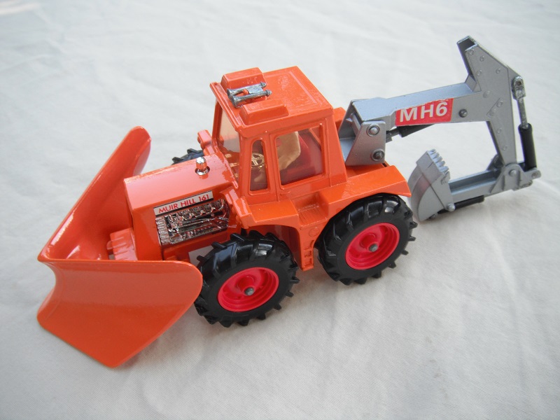 10.Dk.orange tractor/org plow/silver backhoe &amp; scoop/clear windows/thick tires/red hubs/dk.red int/1972 England cast/MH6 labels.