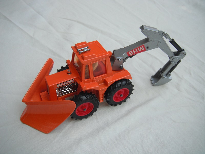 8. Orange tractor/org plow/sil backhoe &amp; scoop/lt.amb wind/thick tires/dk.red hubs/dk.red int/1972 England cast/upside down MH6 labels.